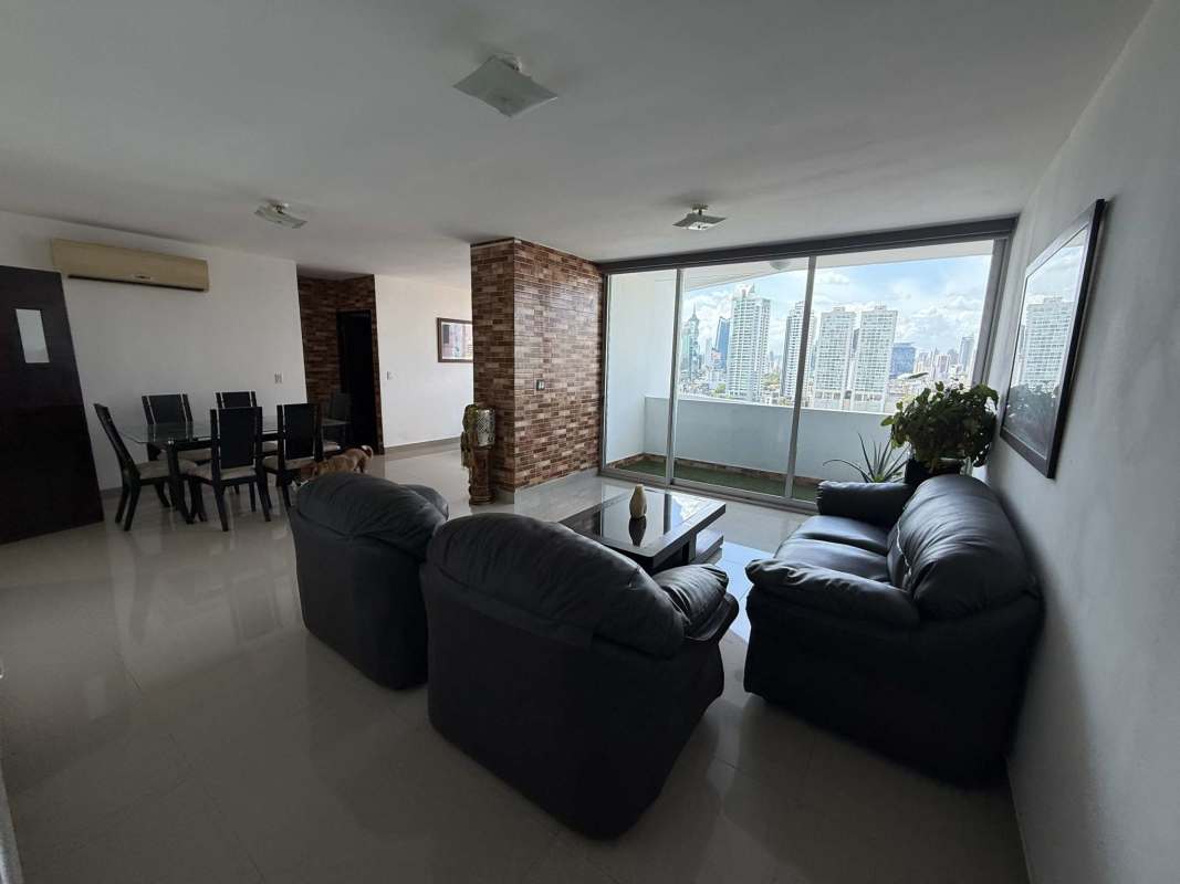 Bright living and dining room with panoramic city views at Infinity Tower San Francisco Panama City