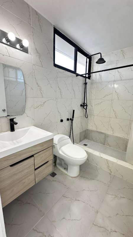 Modern glass-faced residential building in Marbella Panama