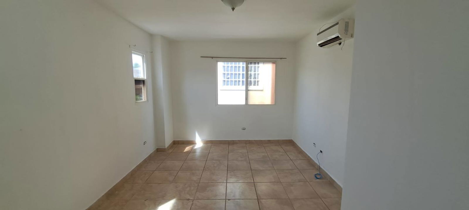 Modern kitchen with granite countertops, gas stove, black cabinets in PH Everest Brisas del Golf Panama