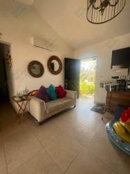Spacious living room with vaulted ceiling, plenty of natural light at Punta Chame beach house