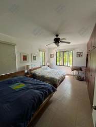 Cozy kitchen fully equipped with gas stove, wood cabinets, tile countertops in Punta Chame Panama beach house