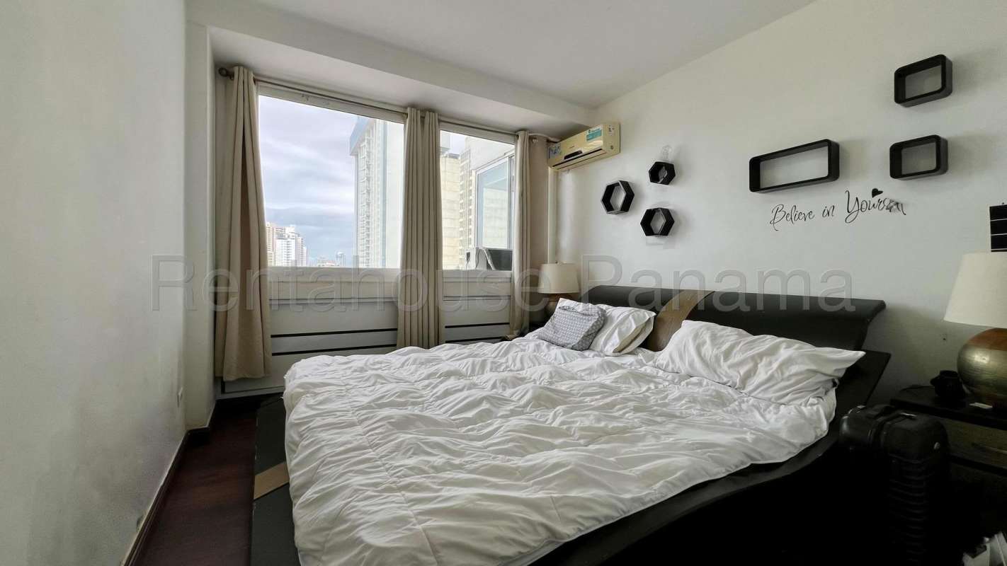 Bedroom with city skyline view, closet and AC in PH Plaza Paitilla Panama