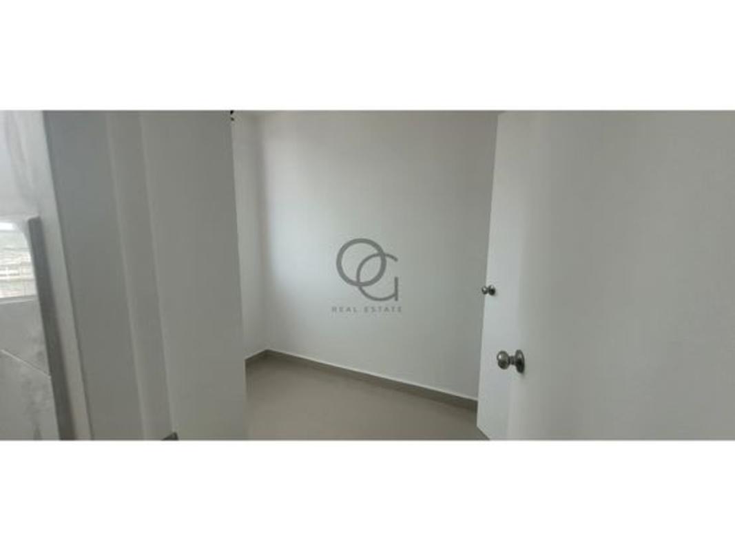 Modern dining room with glass table, upholstered chairs, air conditioning in Panama City apartment