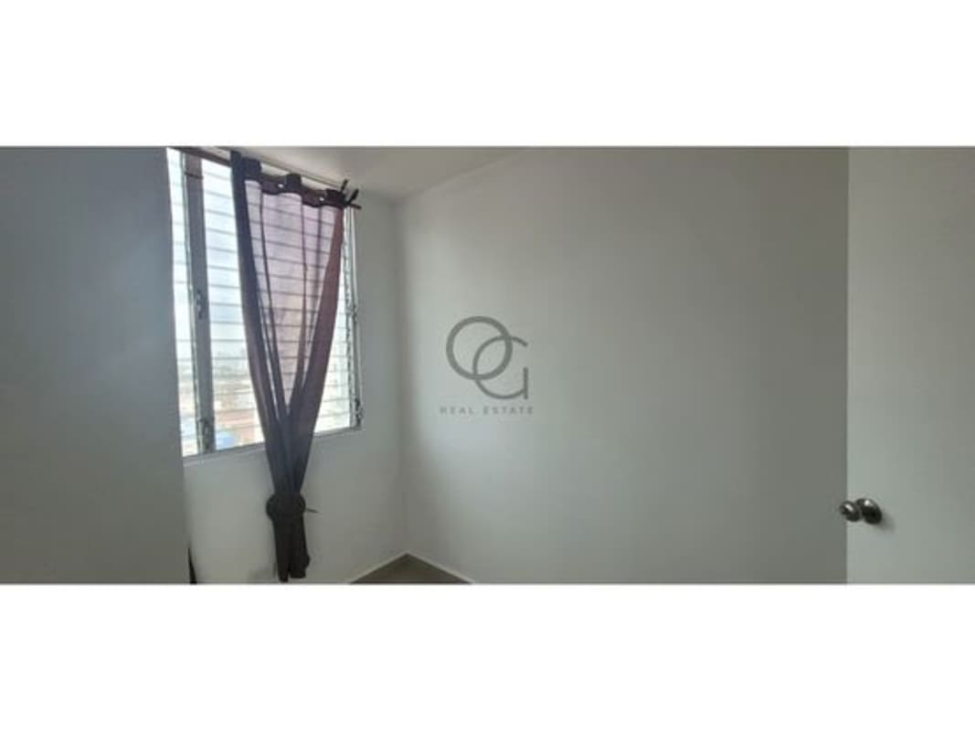Minimalist bedroom with window, curtains, AC in Panama apartment rental