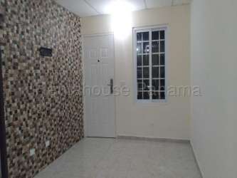 Entry hallway with mosaic accent wall in affordable house La Chorrera Panama