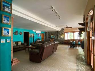 Traditional style bedroom with blue walls, large window doors to balcony and sea view Marina del Rey