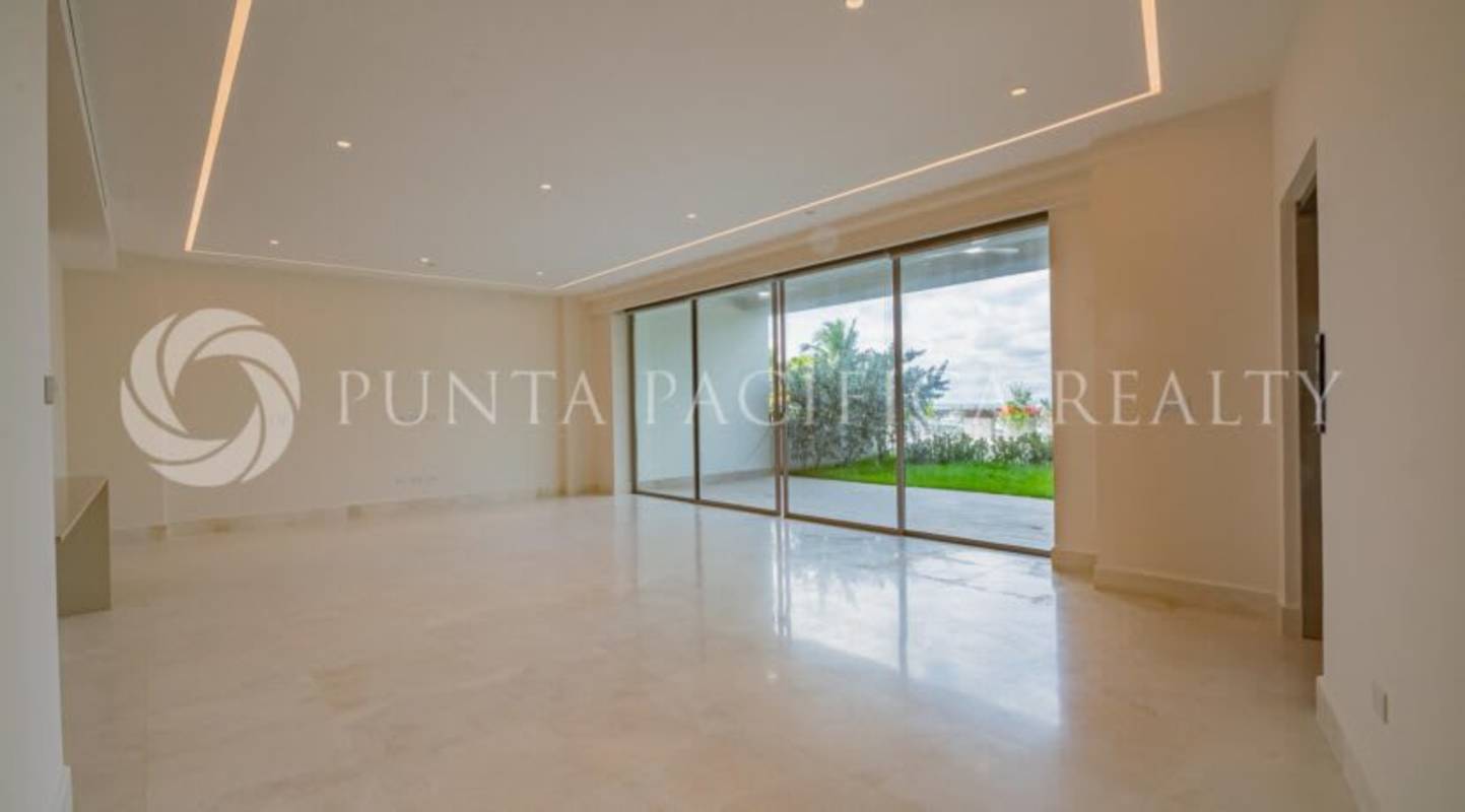 Modern living room with marble floors, floor-to-ceiling windows at Beach Club Residences Ocean Reef Panama City