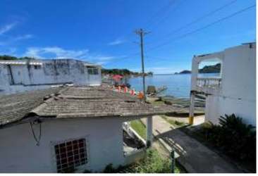 Colorful two-story villa Caribbean garden pathway Isla Grande Portobelo Panama