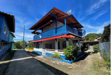 Blue red white Caribbean house with wrap balcony Isla Grande Panama