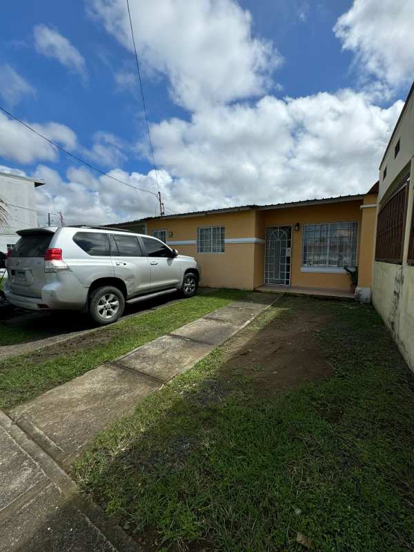Single-story house exterior with parking and front garden Villas de Don Bosco Panama