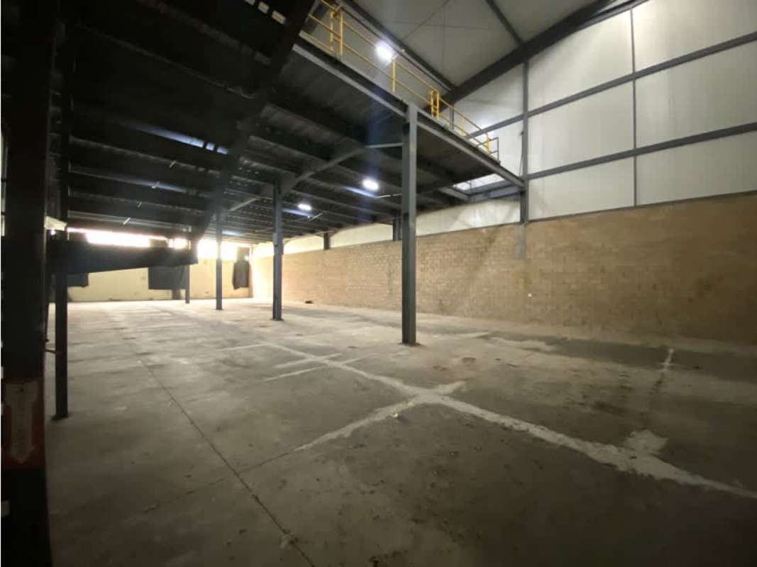 Warehouse interior with roll-up metal doors loading dock wide space Villa Zaita Panama