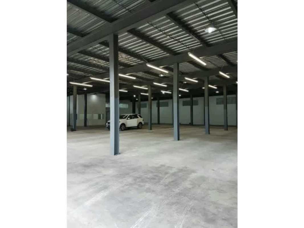 Open interior of industrial warehouse with high ceiling steel beams in Llano Bonito Panama