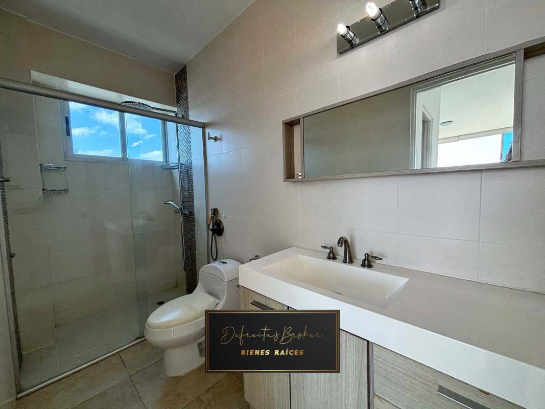 Open concept modern kitchen with granite countertops in duplex apartment PH H2O on Avenida Balboa Panama City