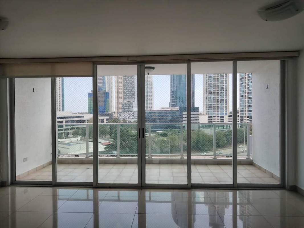 Open kitchen with granite countertops, oven, fridge and light cabinets at PH Costa View Costa del Este Panama