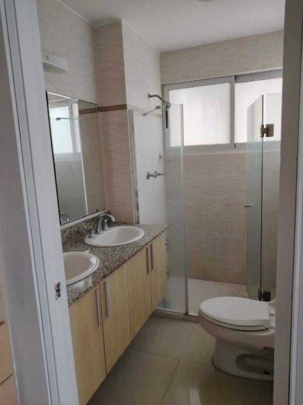 Bedroom featuring large window, closet, AC in Costa View Condo Costa del Este