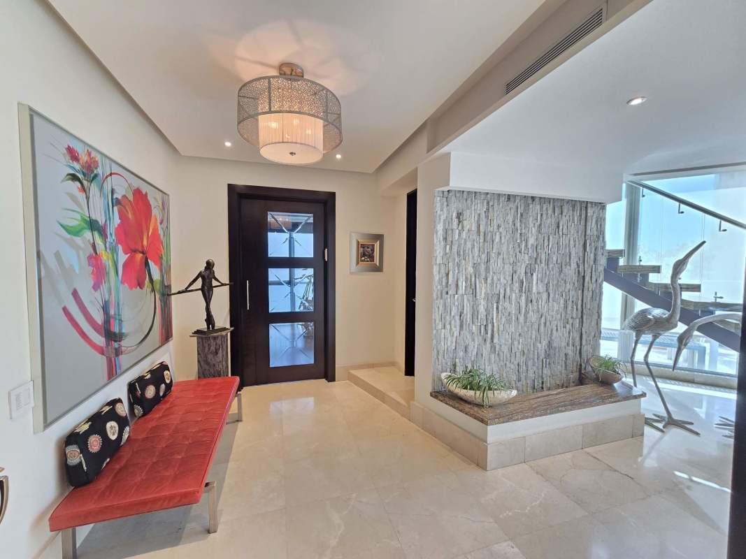 Spacious penthouse master bedroom with ocean-view balcony at Blue Bahía Punta Pacifica Panama