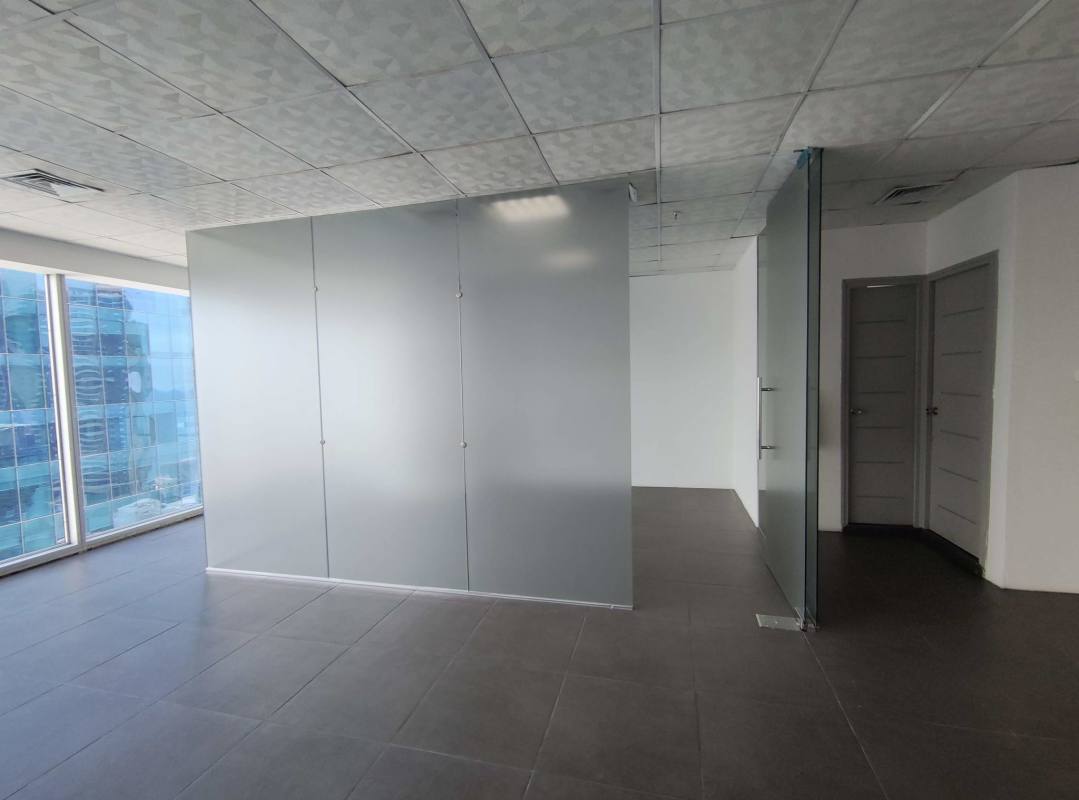 Bright minimalistic open office with glass wall and ceramic flooring in Oceania Business Plaza