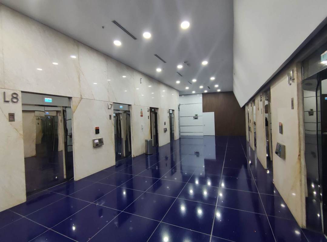 Elevator lobby with marble walls and glossy tiles in Punta Pacifica Panama office tower