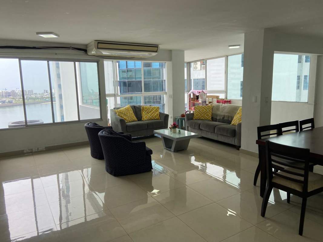 Open concept dining and living space with large windows ocean view PH Las Perlas Punta Paitilla Panama City