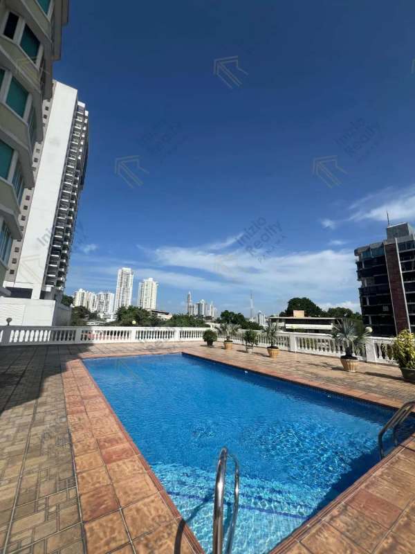 Swimming pool with terrace and skyline view at PH El Cangrejo Tower apartment Panama City