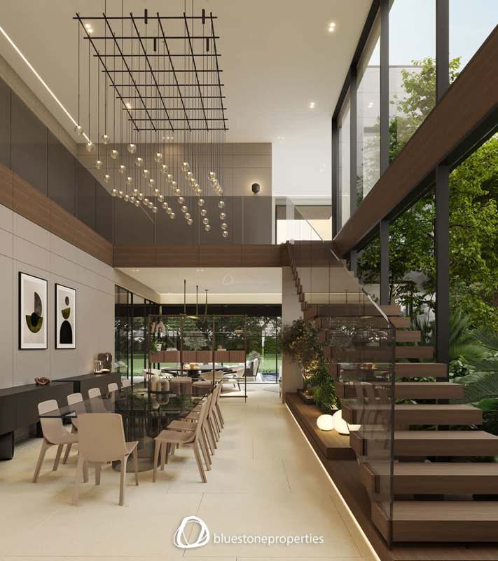 Double height ceiling dining and living room with large windows in Santa Maria luxury house Panama