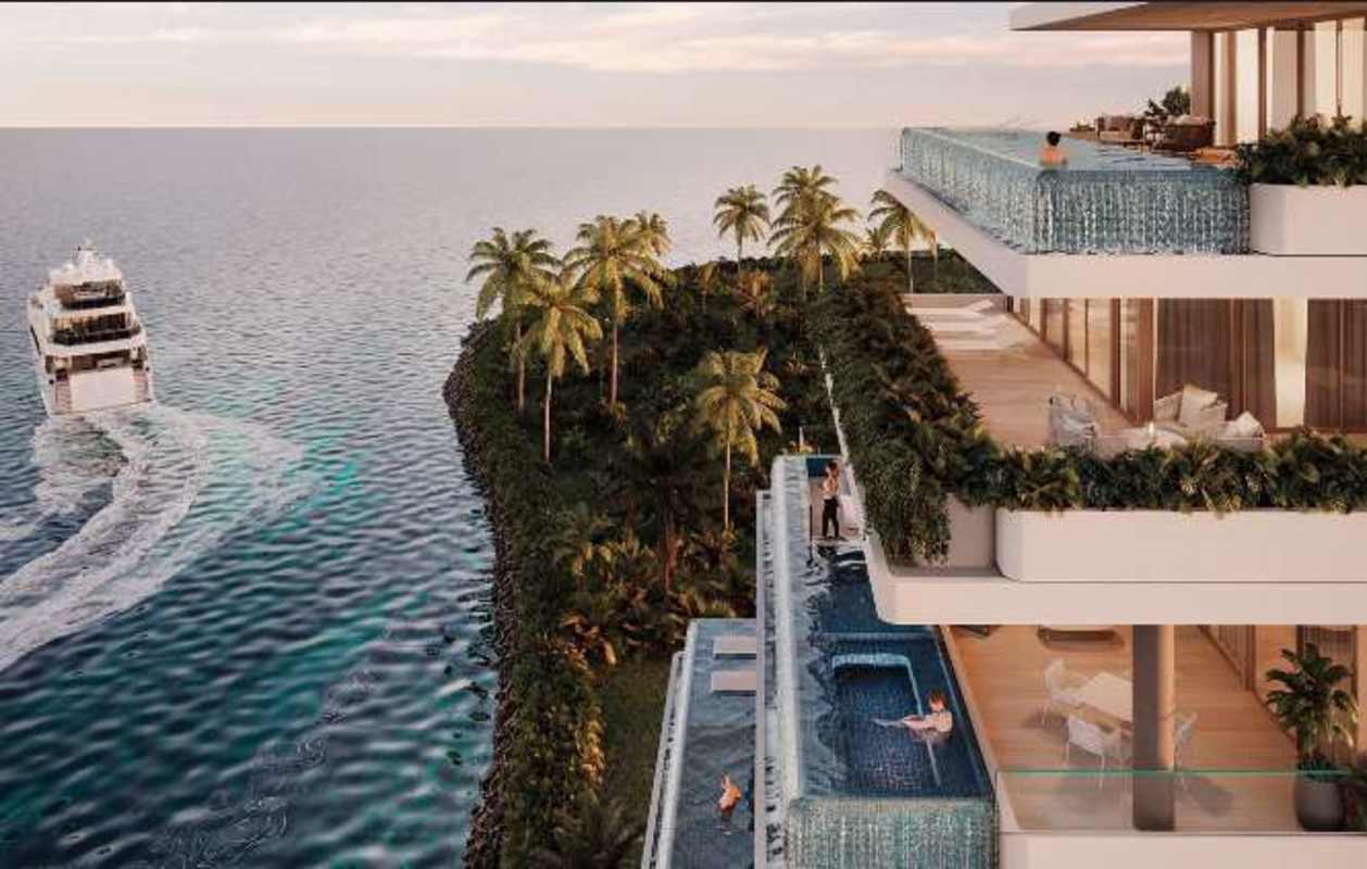 Upscale oceanfront condominium complex with infinity pools and yachts nearby at Ocean Reef Panama