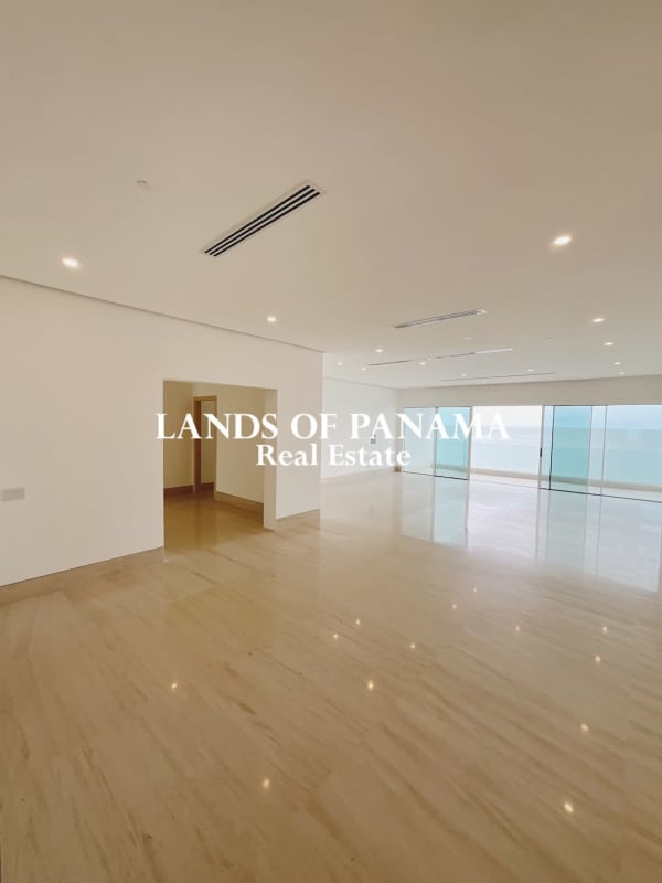 Modern living room with floor-to-ceiling windows and ocean view in Ocean Reef Islands Punta Pacífica