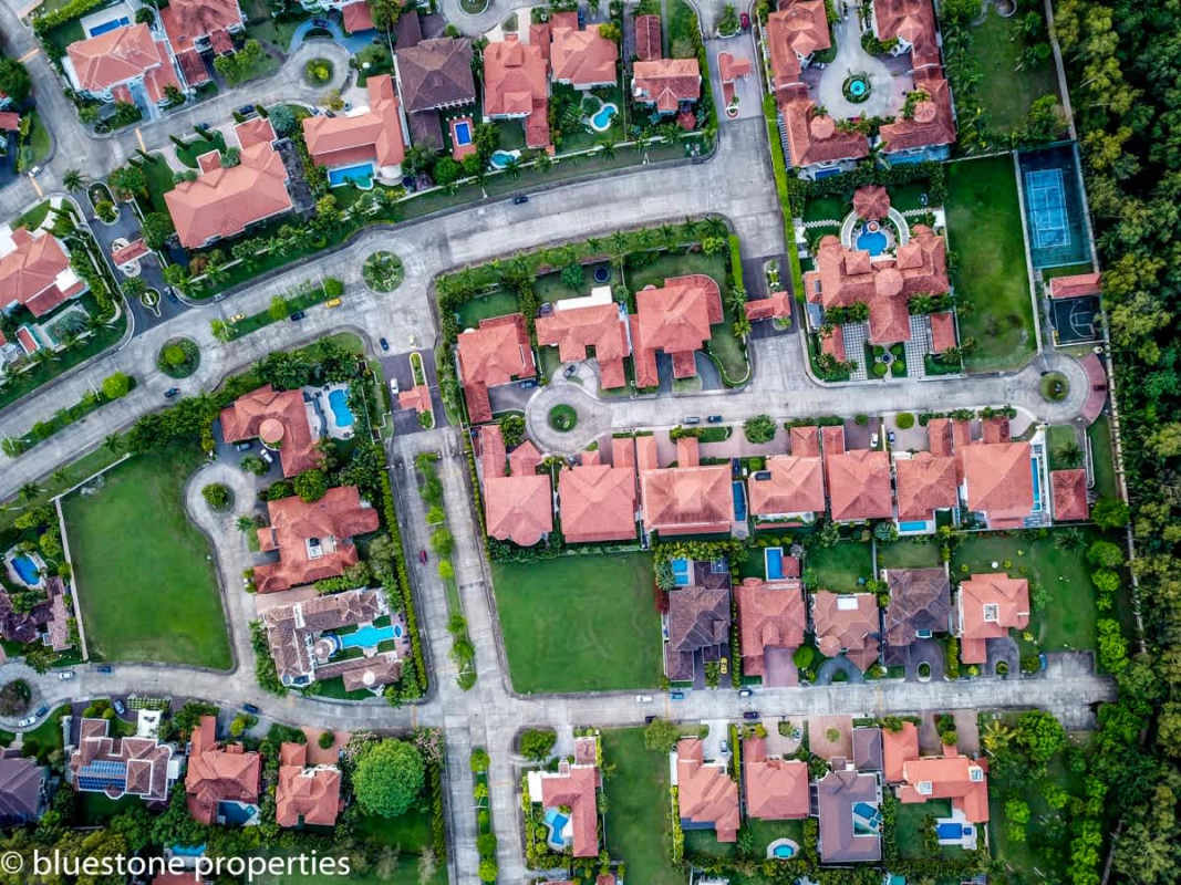 Exclusive community tennis court within gated luxury estate compound Costa del Este