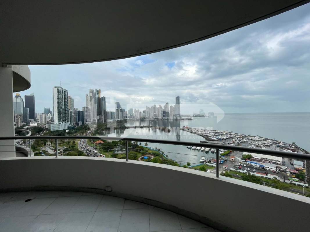 Bright living dining area with tile floor, ceiling fans, ocean view windows at PH La Ensenada Avenida Balboa