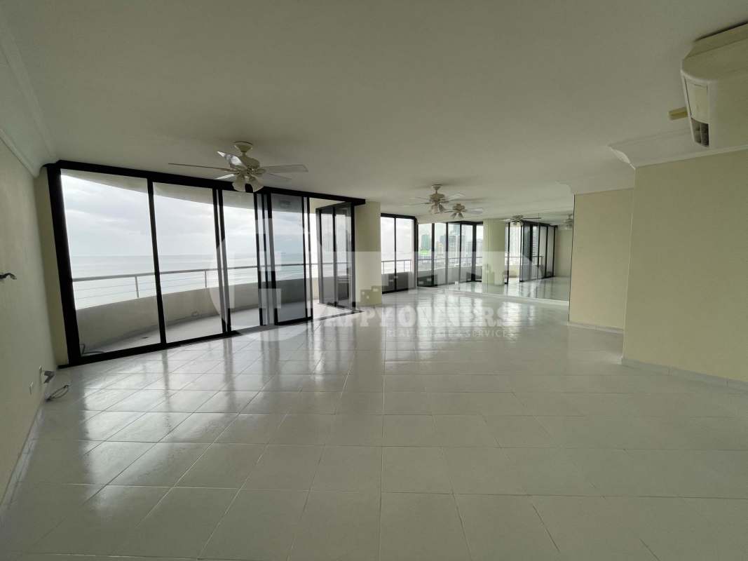 Spacious open living dining layout with large windows and terrace PH La Ensenada Panama