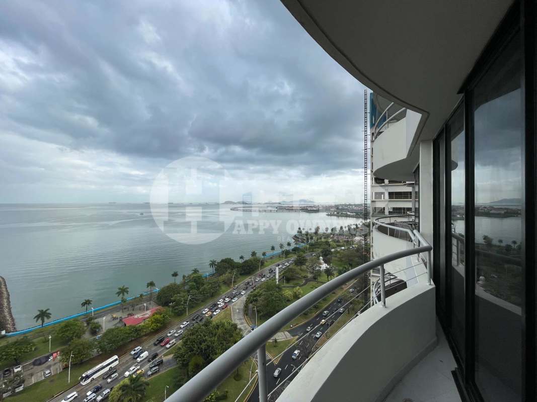 Bedroom with large windows and city skyline view PH La Ensenada Panama