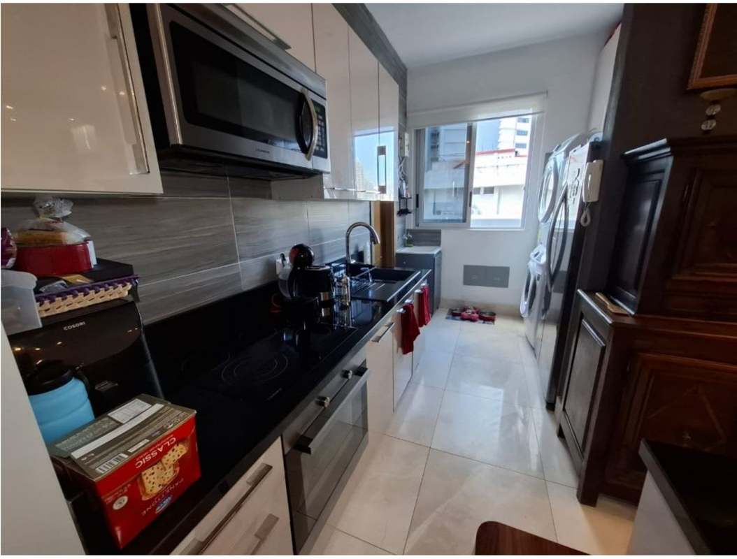 Contemporary kitchen with black countertop gray backsplash appliances PH Park City Obarrio Panama