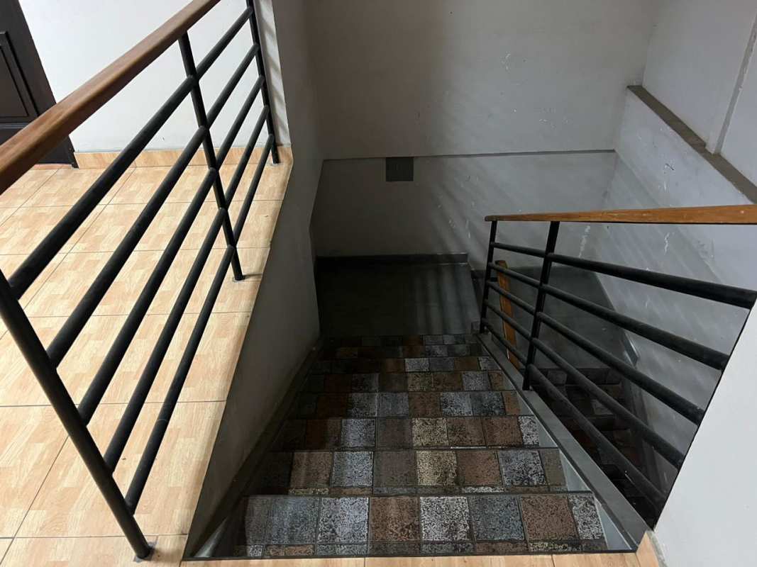 Interior stairwell with tile floors and metal railing commercial building Panama