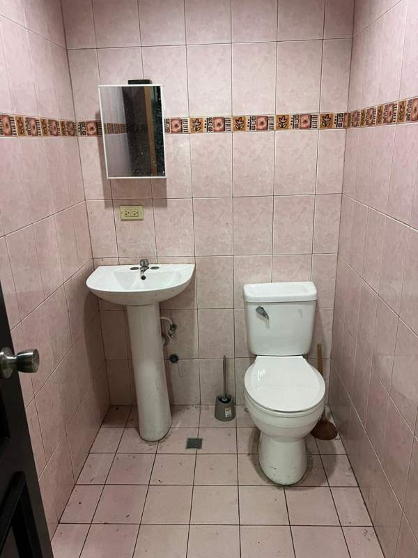 Traditional style kitchen with granite countertop brown cabinets stainless sink in commercial building