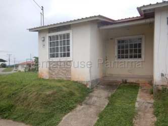 Side angle of suburban house with lawn and large windows, La Chorrera Panama