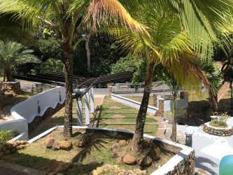 Infinity edge pool with lounge deck overlooking mountain valley in Chicá Sorá
