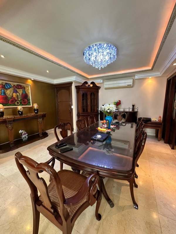 Spacious master bedroom with wooden furniture and large windows PH Mystic Point Punta Pacifica