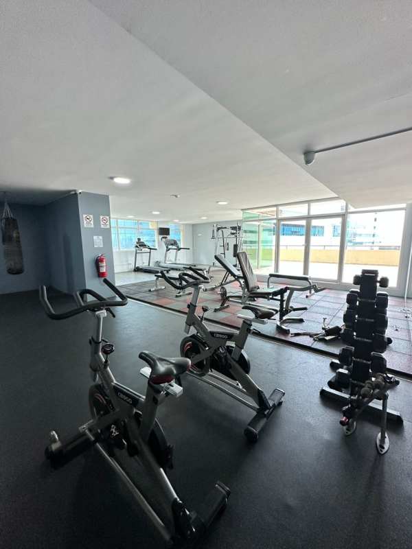 Pool deck with landscaped garden and city skyline at PH Mystic Point Punta Pacifica Panama