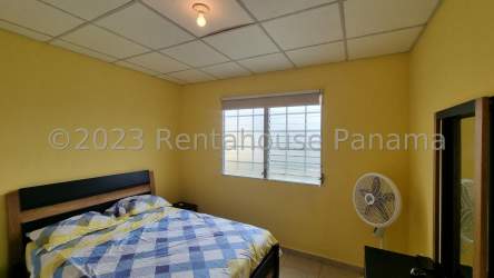 Simple bathroom with shower, toilet, and sink in house Montelimar La Chorrera