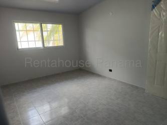 Bedroom featuring tiled floors, two windows with security bars in Villas de Arraiján Panama