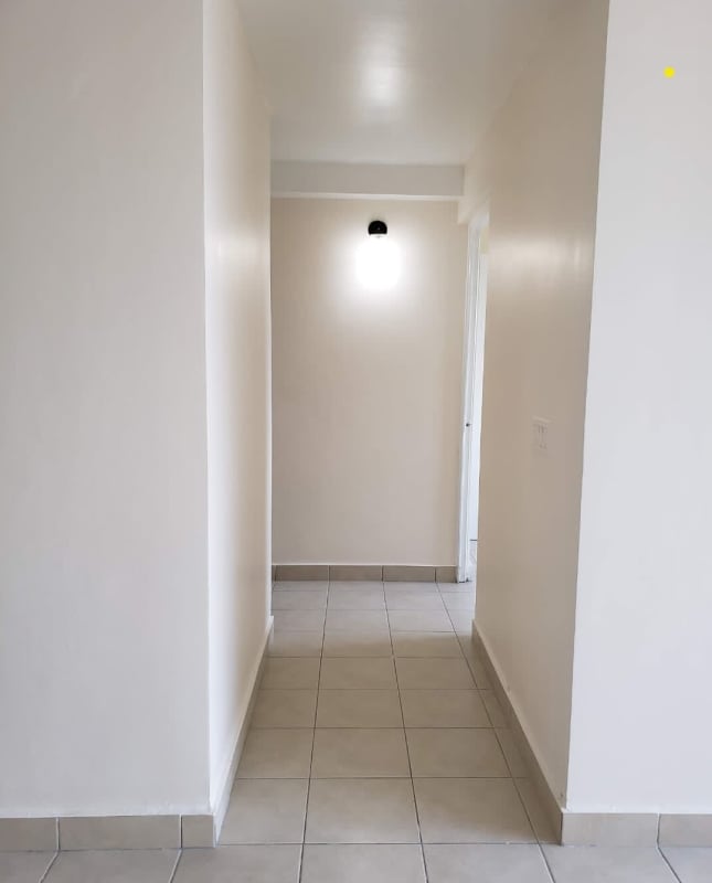 Bright living dining room with balcony access at PH Las Hortensias Panama City