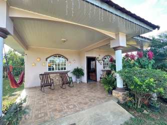Tropical covered porch with wooden furniture and garden view in Santa Ana Los Santos Panama