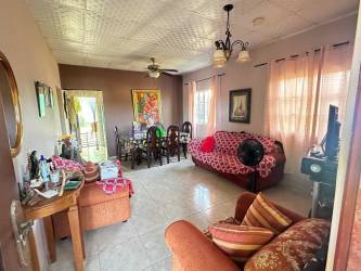 Combined living dining room house in Santa Ana Los Santos tiled floors ceiling fan