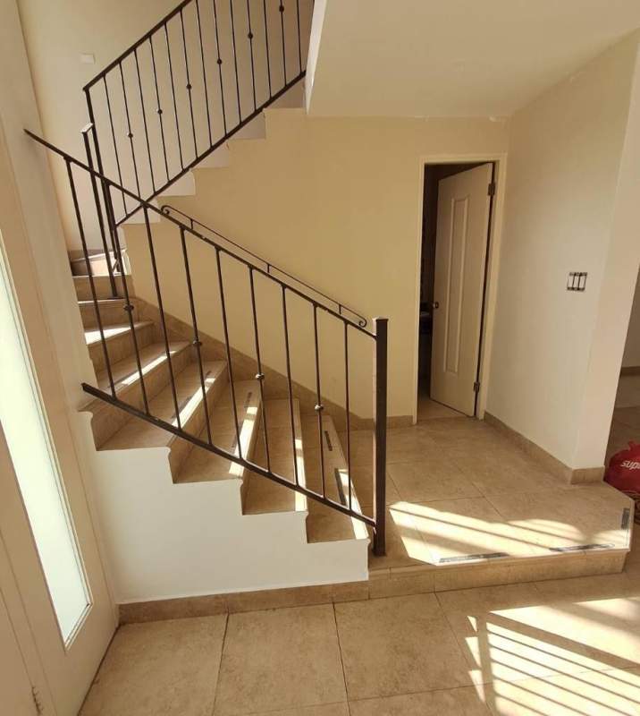 Spacious traditional kitchen with granite countertops and wood cabinets in Embassy Club Clayton Panama City