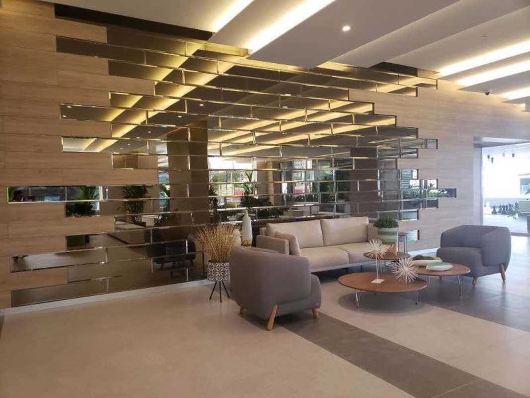 Spacious living and dining area with panoramic windows PH Vivendi Green Edison Park Panama