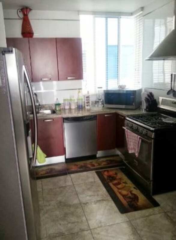 Contemporary kitchen with red cabinets, granite counters, stainless appliances PH Bella Vista Park