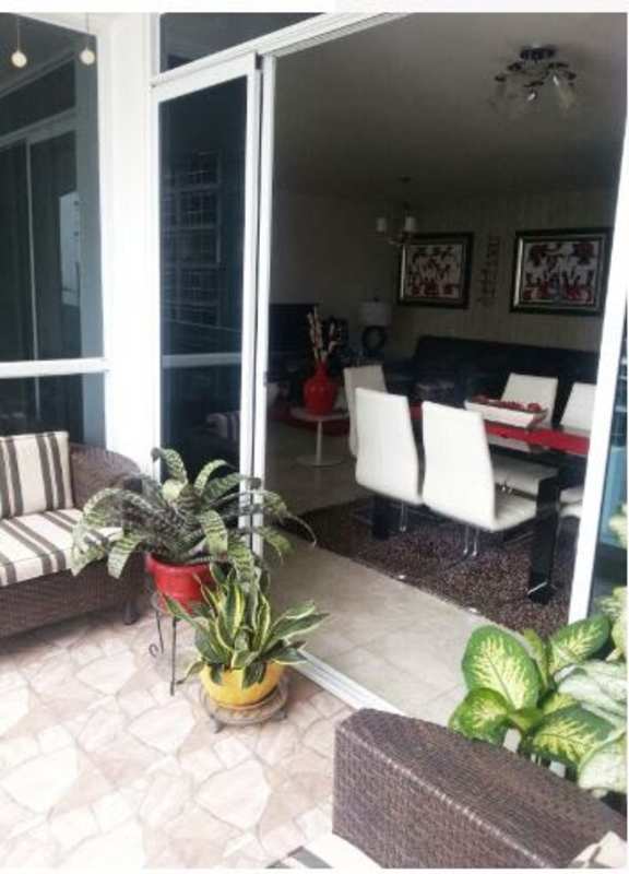 Dining room with glass doors opening to balcony city views PH Bella Vista Park Panama City
