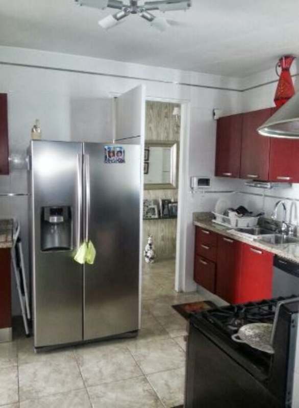 Bright modern kitchen with stainless appliances and large window PH Bella Vista Park Panama City