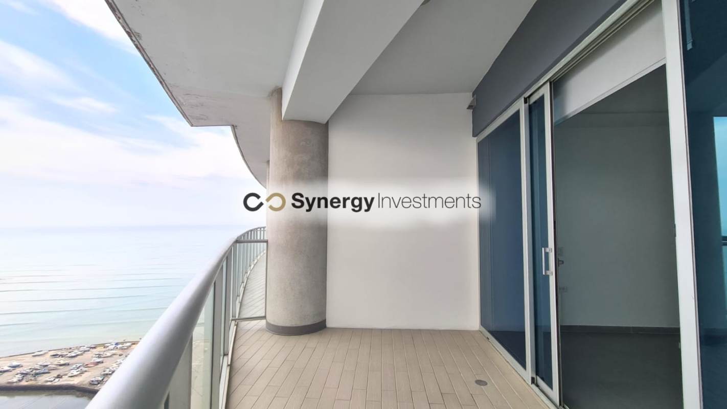 Bedroom with floor-to-ceiling windows sea skyline view Yacht Club Tower Panama City