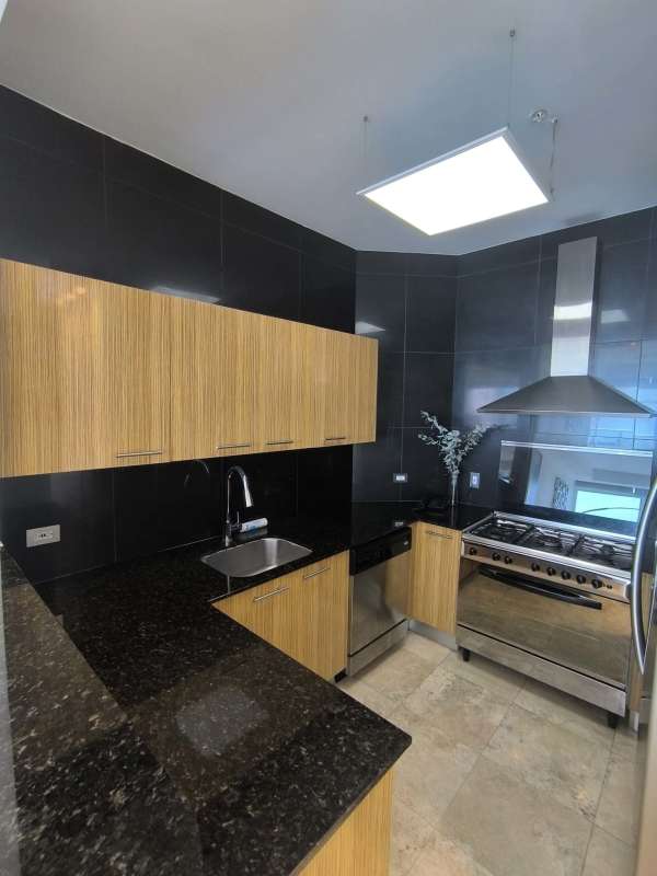 Second bedroom with ocean view balcony, large windows, walk-in closet and marble floor in PH BICSA Tower